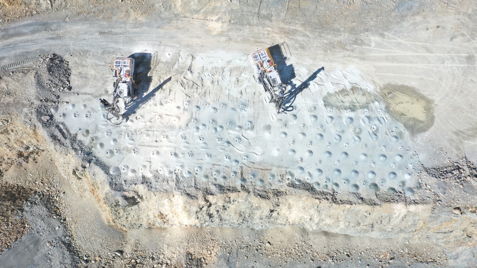 Aerial view of a rig working at dusk with lights on